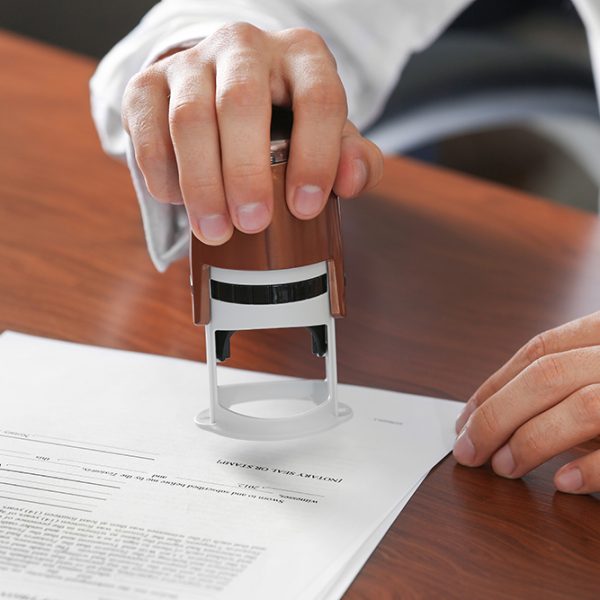 Notary public in office stamping document